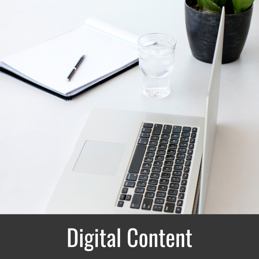 Content Solutions Digital Content Button with Laptop, Notebook and water glass