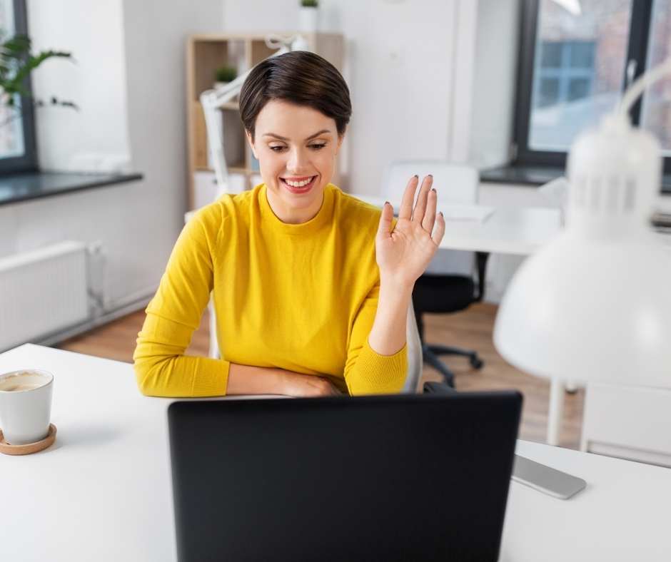 Woman in yellow top on Zoom call